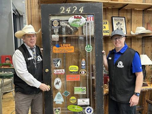Dave and Brian Knoll with the original 2424 door from the N. Fourth St. store