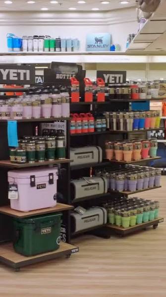 Black Sheep Drinkware showroom shelves with YETI coolers and tumblers and Stanley drinkware.