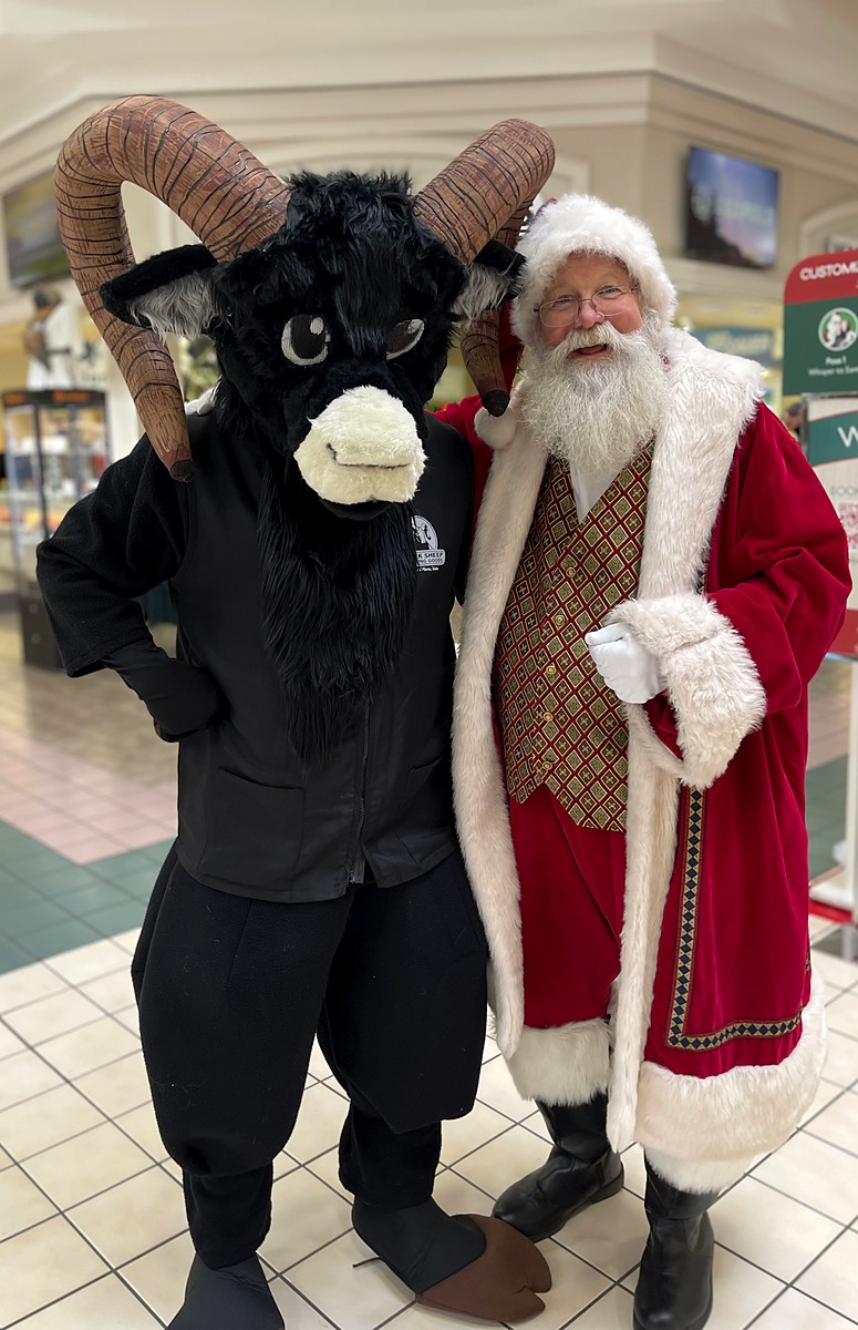 Rocky, the Black Sheep mascot, with Santa